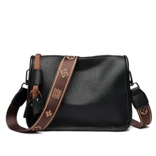 Accueil Sac bandoulière femme en cuir de vachette noir, sangle jacquard